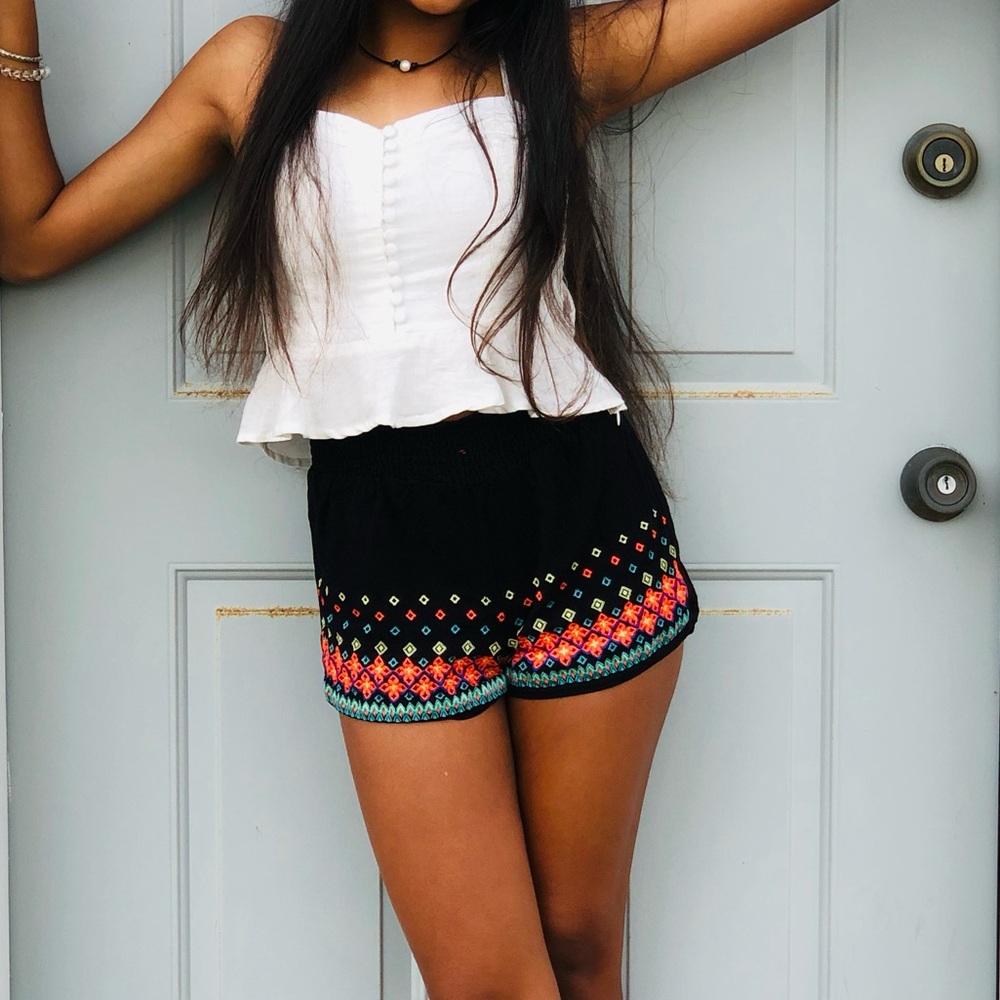 White crop top. Has a zipper on the side. Size XS